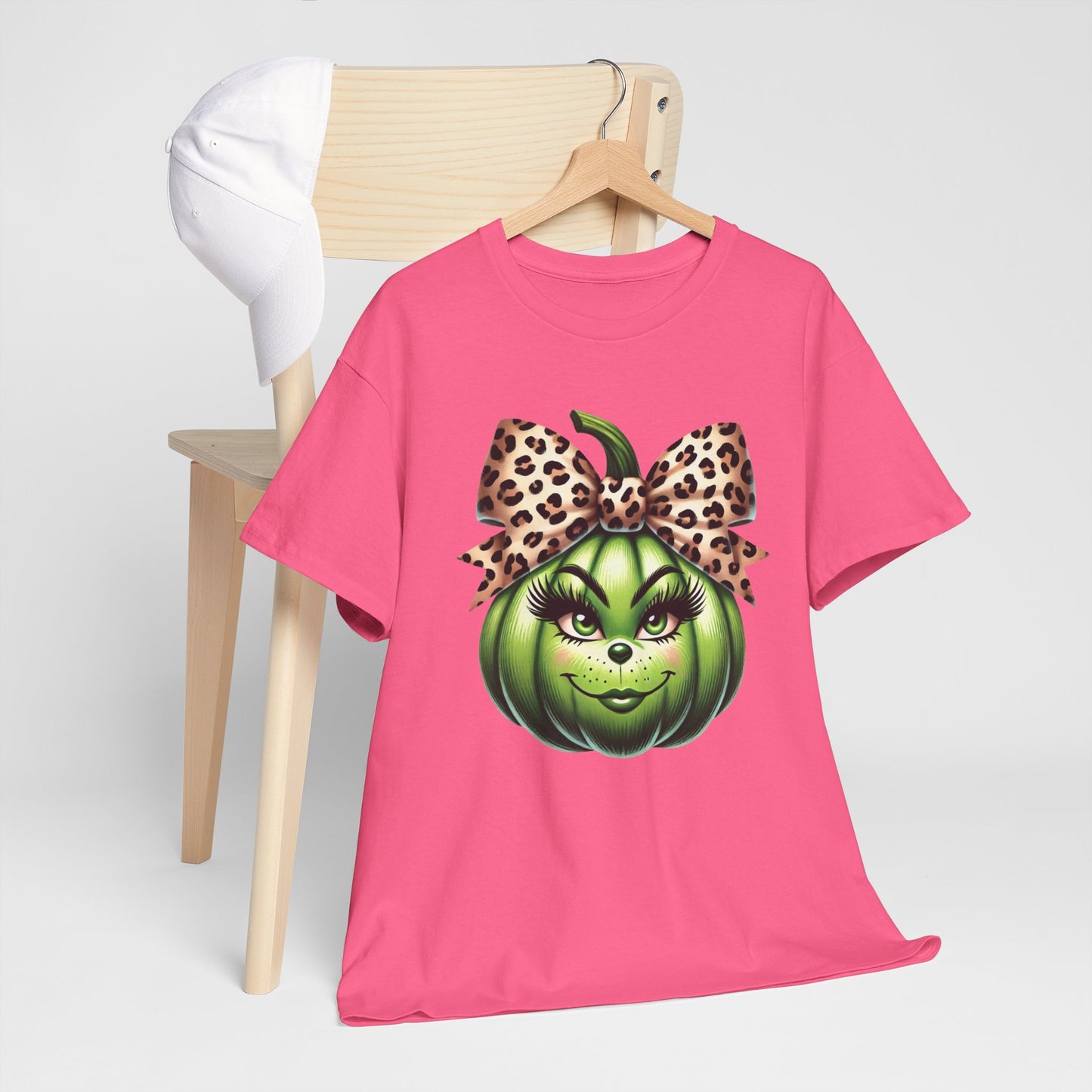 Unisex Heavy Cotton Tee - Feminine Grinch-like Pumpkin with Large Cheetah Print Bow Design