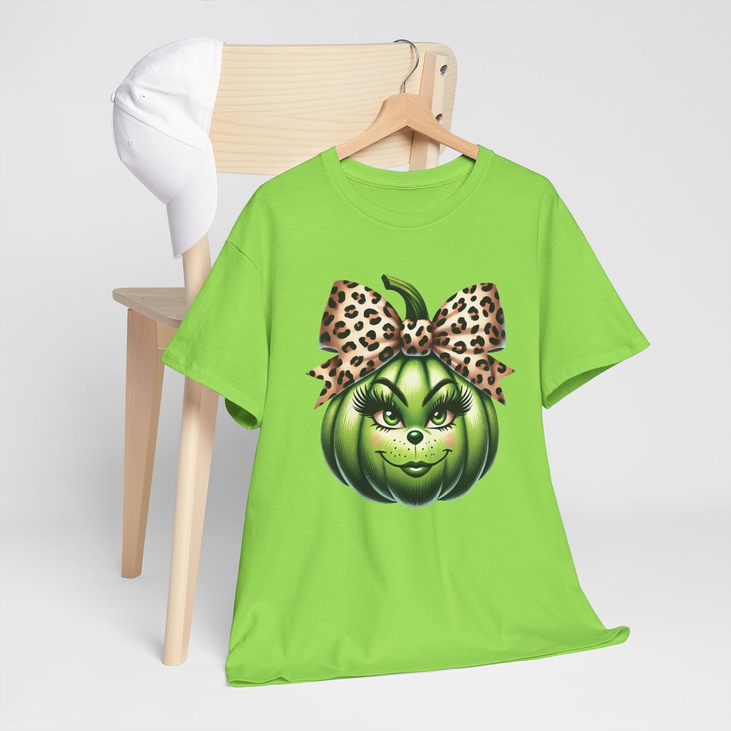 Unisex Heavy Cotton Tee - Feminine Grinch-like Pumpkin with Large Cheetah Print Bow Design