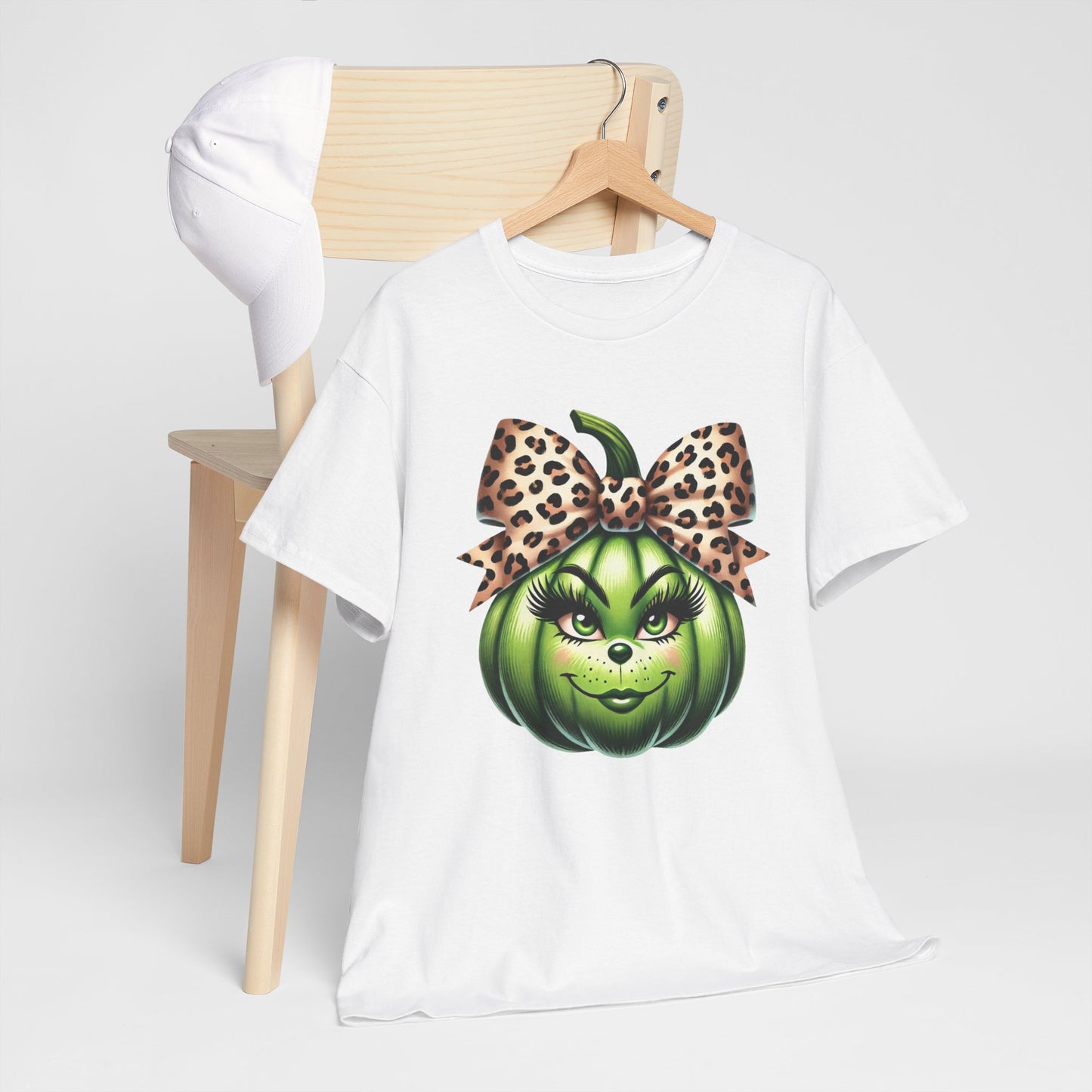 Unisex Heavy Cotton Tee - Feminine Grinch-like Pumpkin with Large Cheetah Print Bow Design