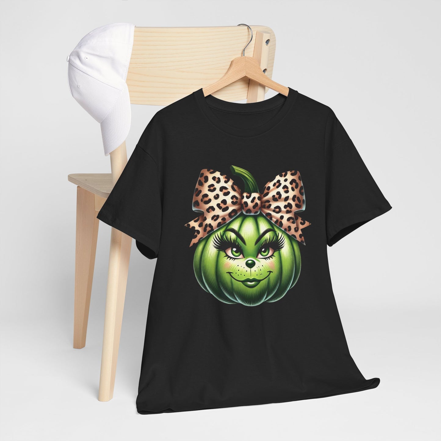 Unisex Heavy Cotton Tee - Feminine Grinch-like Pumpkin with Large Cheetah Print Bow Design