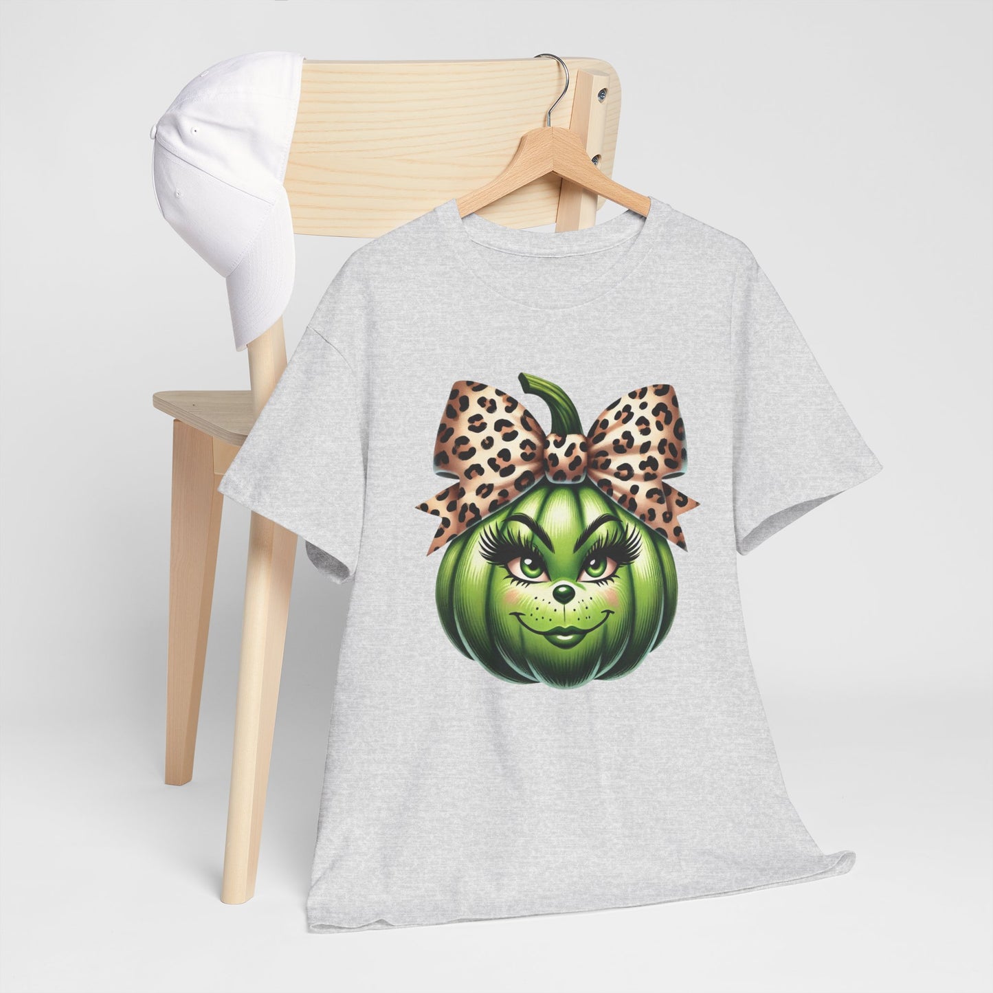 Unisex Heavy Cotton Tee - Feminine Grinch-like Pumpkin with Large Cheetah Print Bow Design