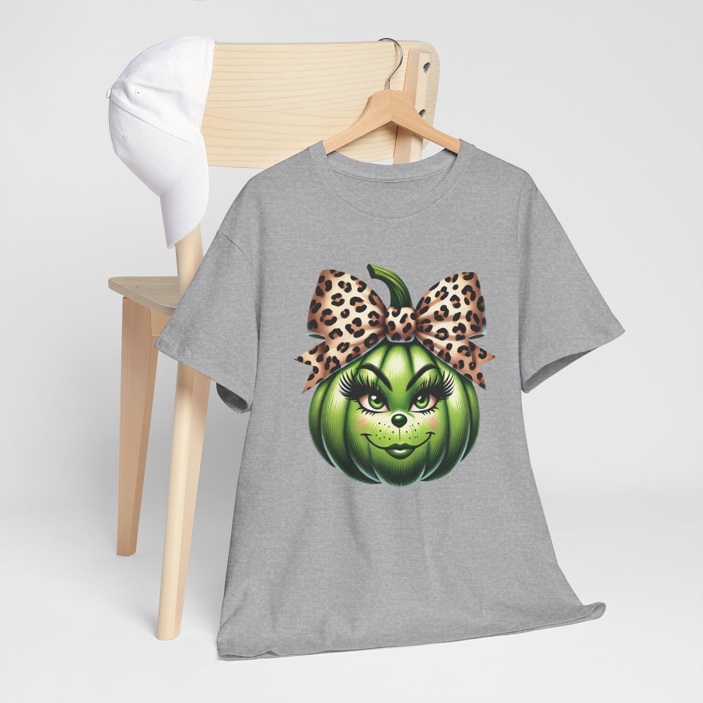 Unisex Heavy Cotton Tee - Feminine Grinch-like Pumpkin with Large Cheetah Print Bow Design